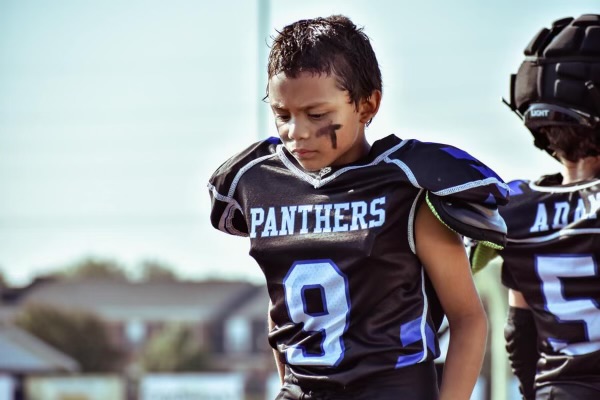 grandson in football gear