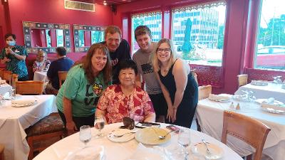Kim and her family dine with former Key Center staff member, Nee.