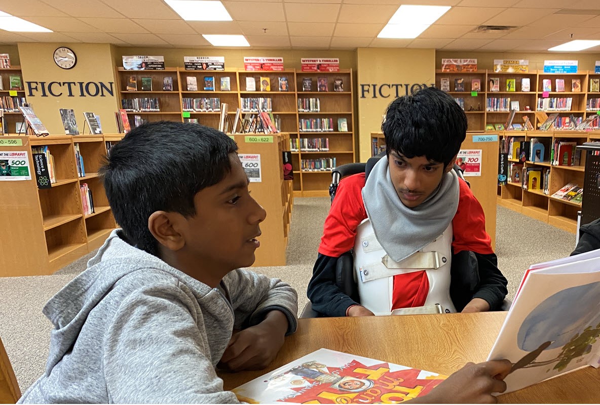 student with reading buddy