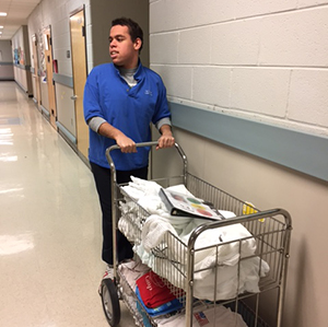 Student with laundry cart