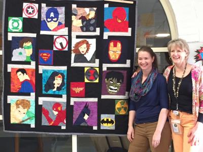 PIcture of quilt with creators Aimee Rand and Nicole Bracken