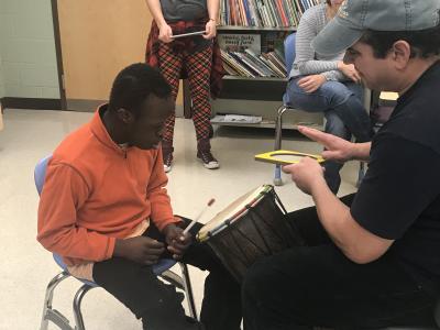 Student practicing with the drum